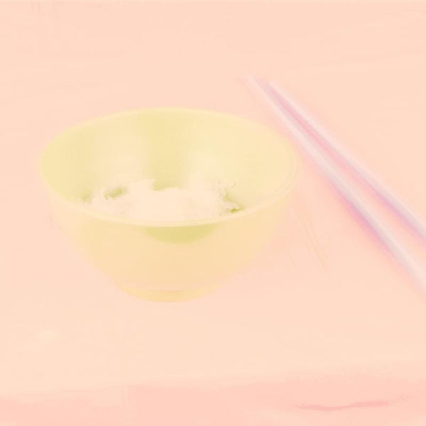 Artificial Paradise by Roy Lee embodies a hazy depiction of a pastel lime green bowl filled with some rice and a pair of chopsticks on a pink surface.
